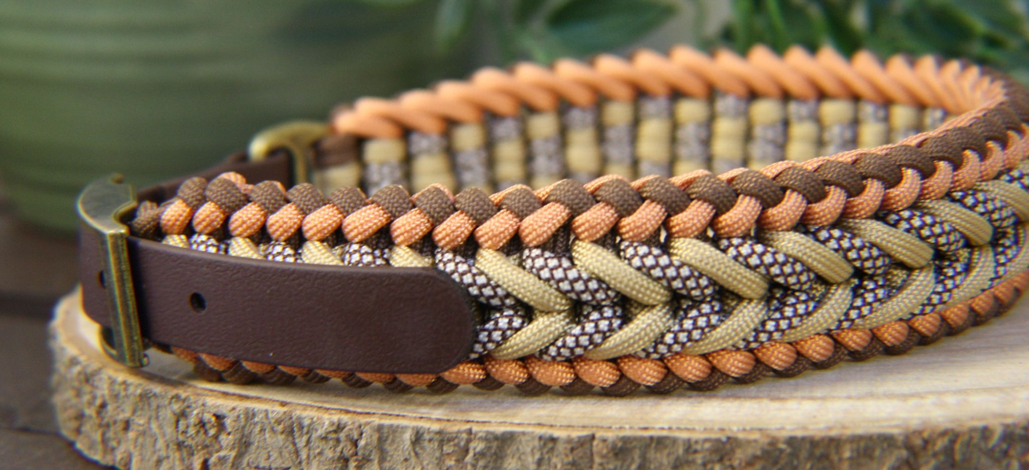 Brown Biothane dog collar adapter on brown and gold paracord collar